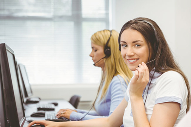 Image of  call centre staff wearing headsets