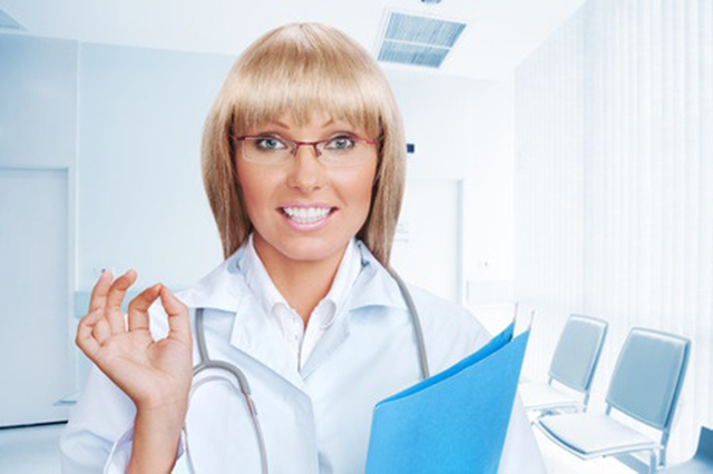 Image of practice nurse with folder in clinic room
